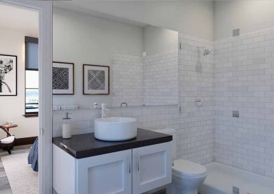 A modern bathroom features white subway tiles, a vessel sink on a dark countertop, white cabinets below, a framed poster on the wall, and a view into a bedroom with a rocking chair.