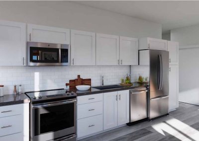 A modern kitchen with white cabinets, stainless steel appliances, and a subway tile backsplash. natural light illuminates the clean, spacious area.